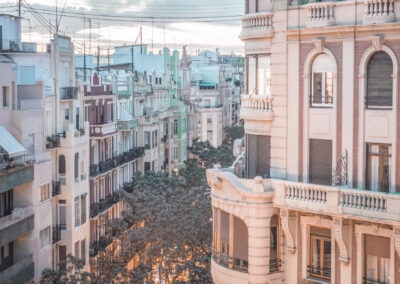 Balcony view of an old city with white buildings and balconies in Valencia