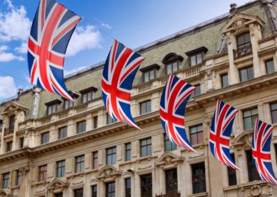 British flags hanging in front of a heritage building