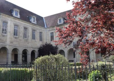A historic building surrounded by gardens