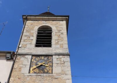 A historic clock tower pictured on a blue summers day
