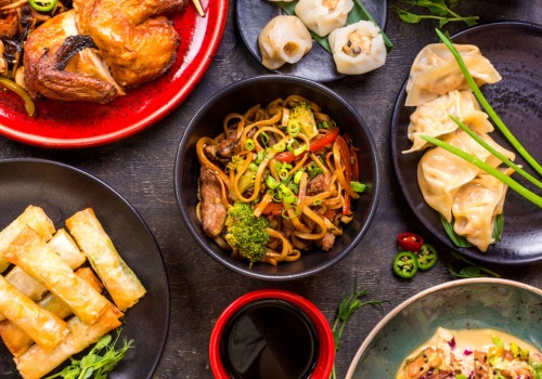 Chinese plates of food in black bowls