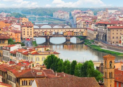 A landscape of the bridges of dlorence with many colourful buildings