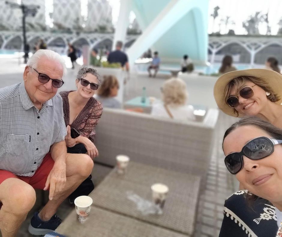 Enjoying an afternoon beer! A group of adults posing for a photo in front of the Valencia museum with beers