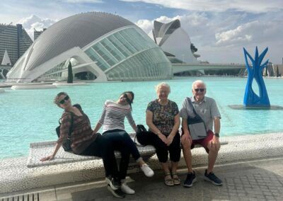 A group of adults posing for a photo in front of the Valencia museum