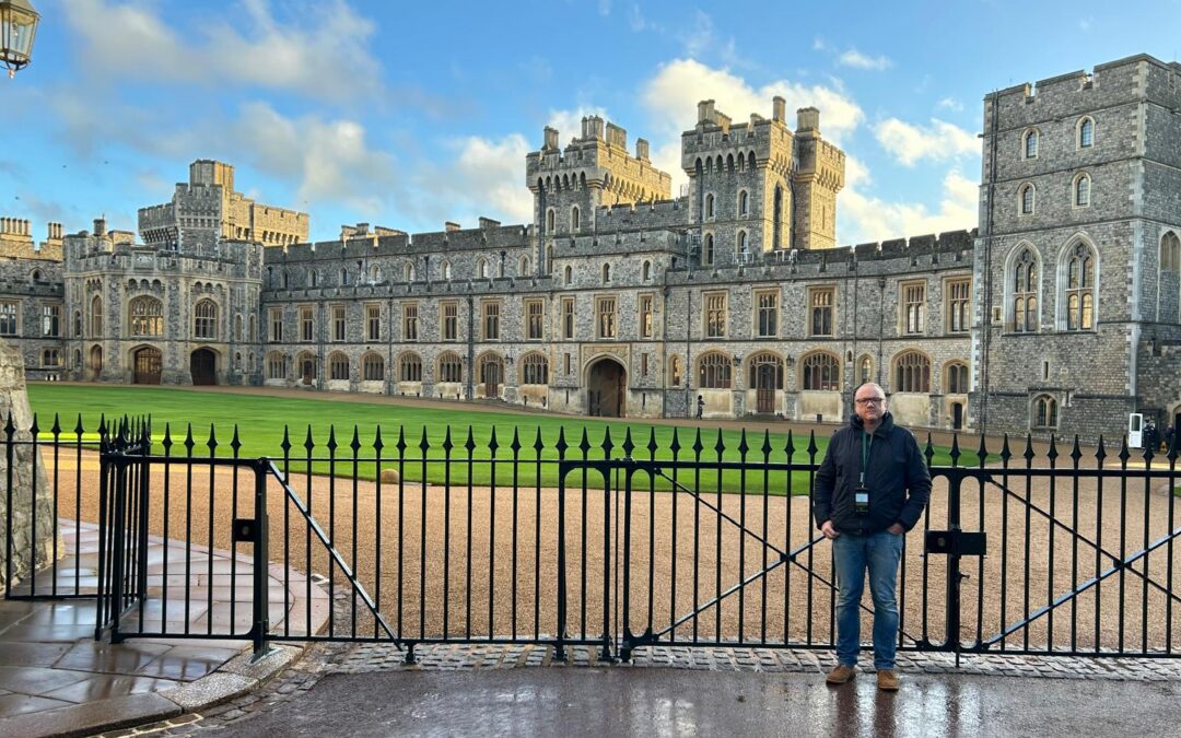 A man stood in front of Windsor Castle in England