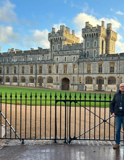 A man stood in front of Windsor Castle in England