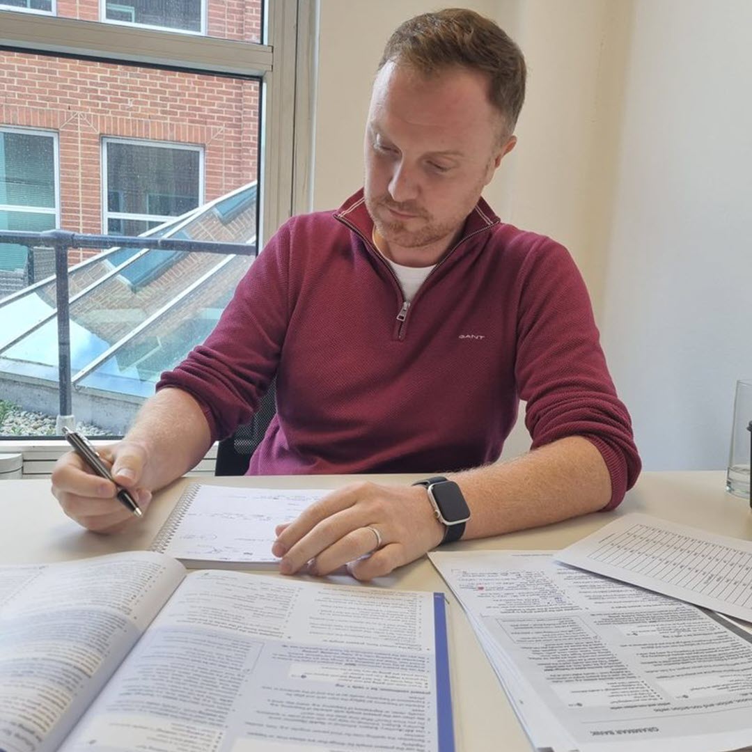 A proud female student holding a certificate
